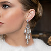 Swanson in pearl earrings