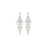 Swanson in pearl earrings