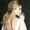 bride with long blonde hair with comb and pearl earrings